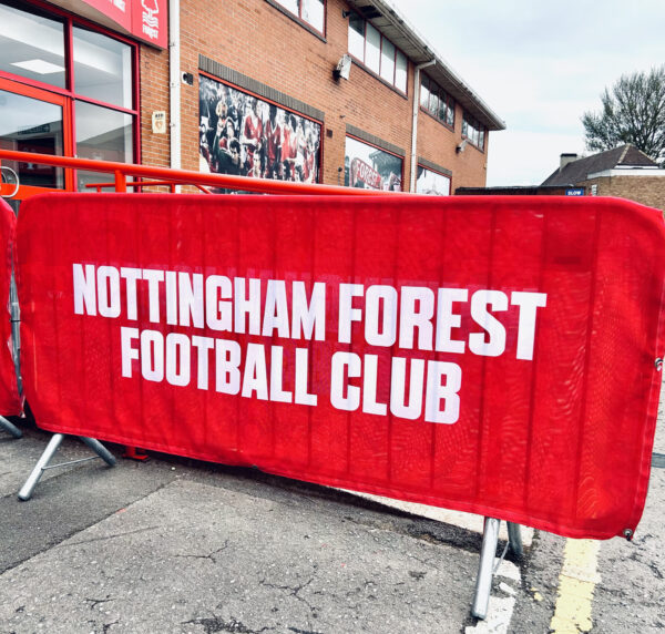 mesh crowd barrier jacket example showing clients logo design for nottingham forest football club